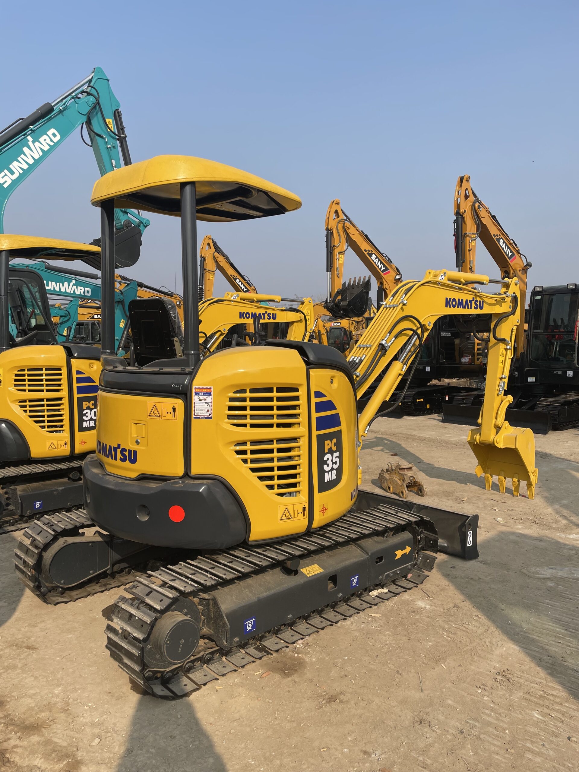 Used KOMATSU PC35 excavator with multiple attachments for sale